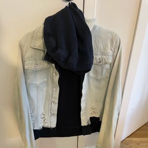 Light wash Free People jean jacket with navy sweatshirt attached